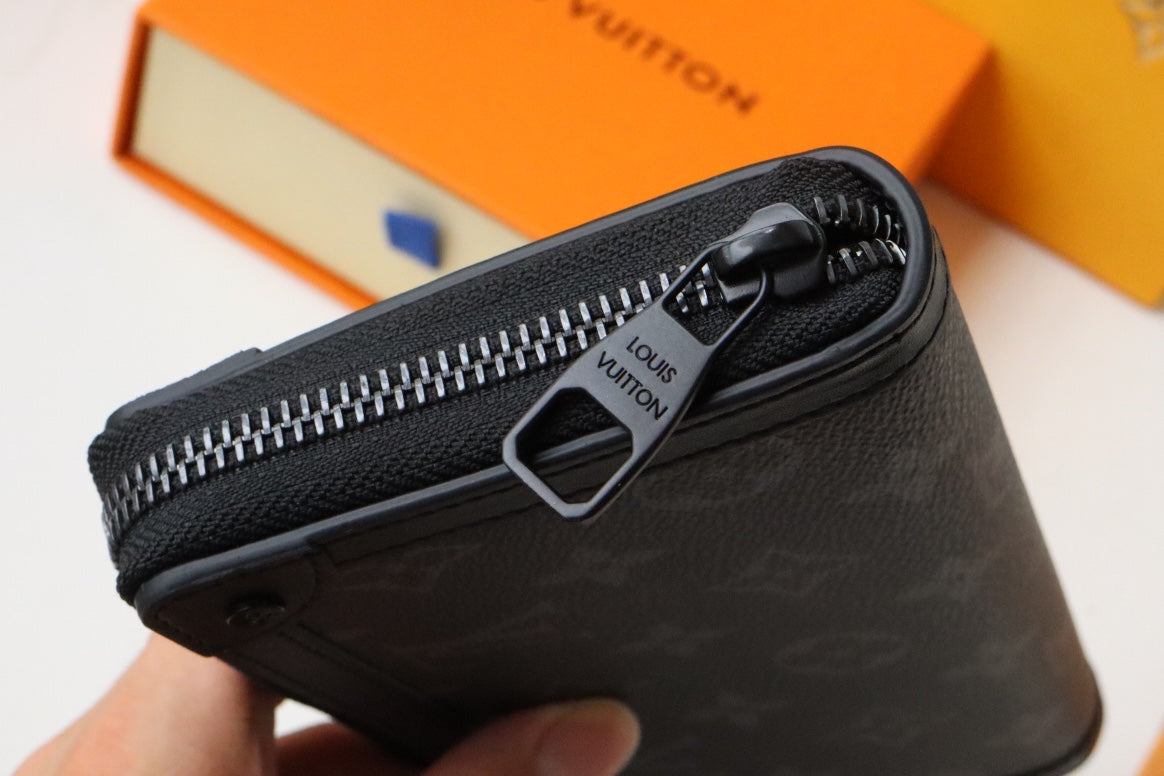 トランク ジッピーウォレット 19.5 ブラック モノグラム キャンバス