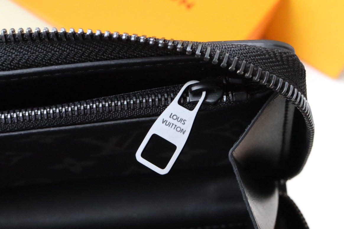 トランク ジッピーウォレット 19.5 ブラック モノグラム キャンバス