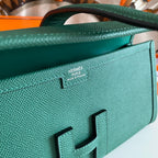 JIGE ELAN 29 CLUTCH IN FOREST GREEN CALFSKIN