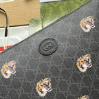CLUTCH WITH TIGER PRINT 30 IN BLACK MONOGRAM CANVAS