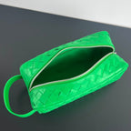 INTRECCIATO CLUTCH 26 IN MALACHITE GREEN CALFSKIN
