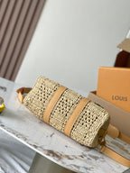 KEEPALL BANDOULIÈRE 25 IN BEIGE CROCHETED RAFFIA AND CALFSKIN TRIM