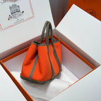 GARDEN PARTY 30CM IN ORANGE MINIMUM TOILETS COTTON CANVAS AND BROWN CALFSKIN