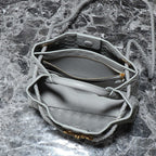 BV SMALL ANDIAMO 25CM GREY LAMBSKIN