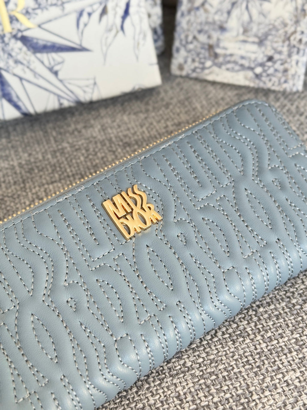 VERTICAL LONG ZIP WALLET 20 IN BABY BLUE QUILTED ALLOVER CALFSKIN