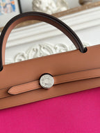ZIP CABINE 31 BAG IN FUCHSIA PINK CANVAS AND BRONZE BROWN CALFSKIN