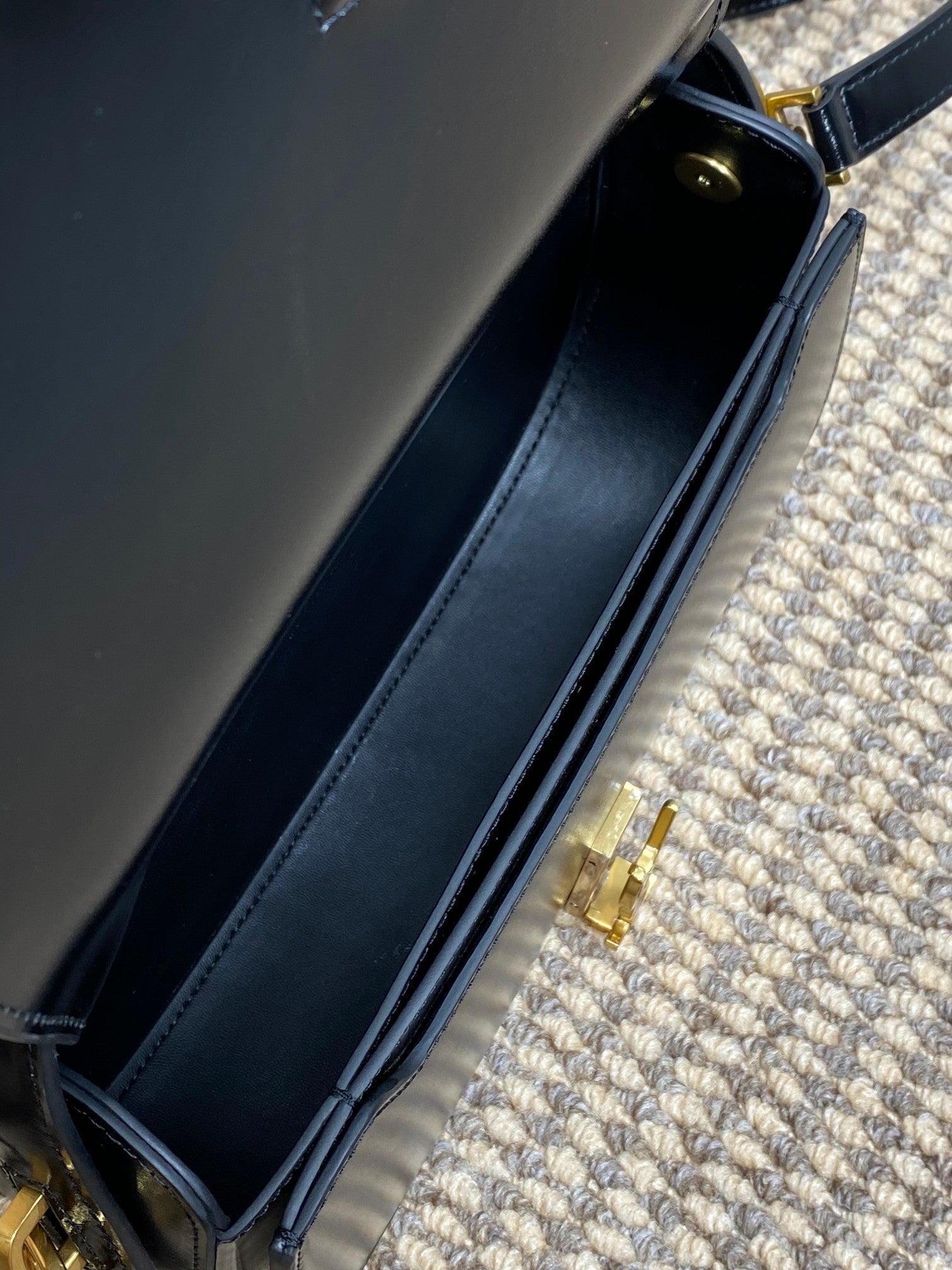 VOLTAIRE HALF-MOON SHOULDER BAG 24 IN BLACK CALFSKIN GOLD METALLIC