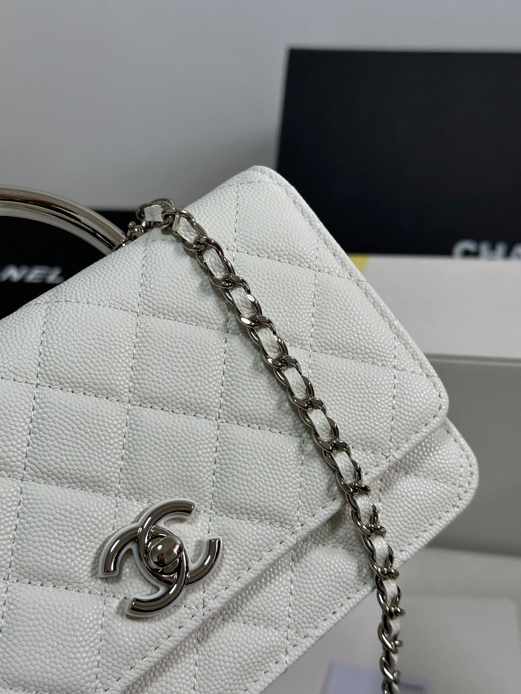 FLAP BAG WITH SILVER-TONE HANDLE 19 IN WHITE CAVIAR SKIN