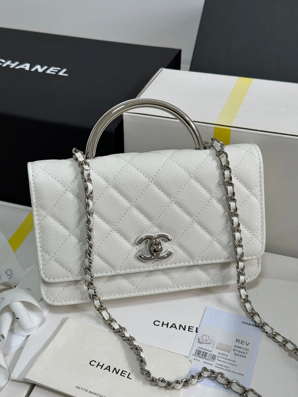 FLAP BAG WITH SILVER-TONE HANDLE 19 IN WHITE CAVIAR SKIN